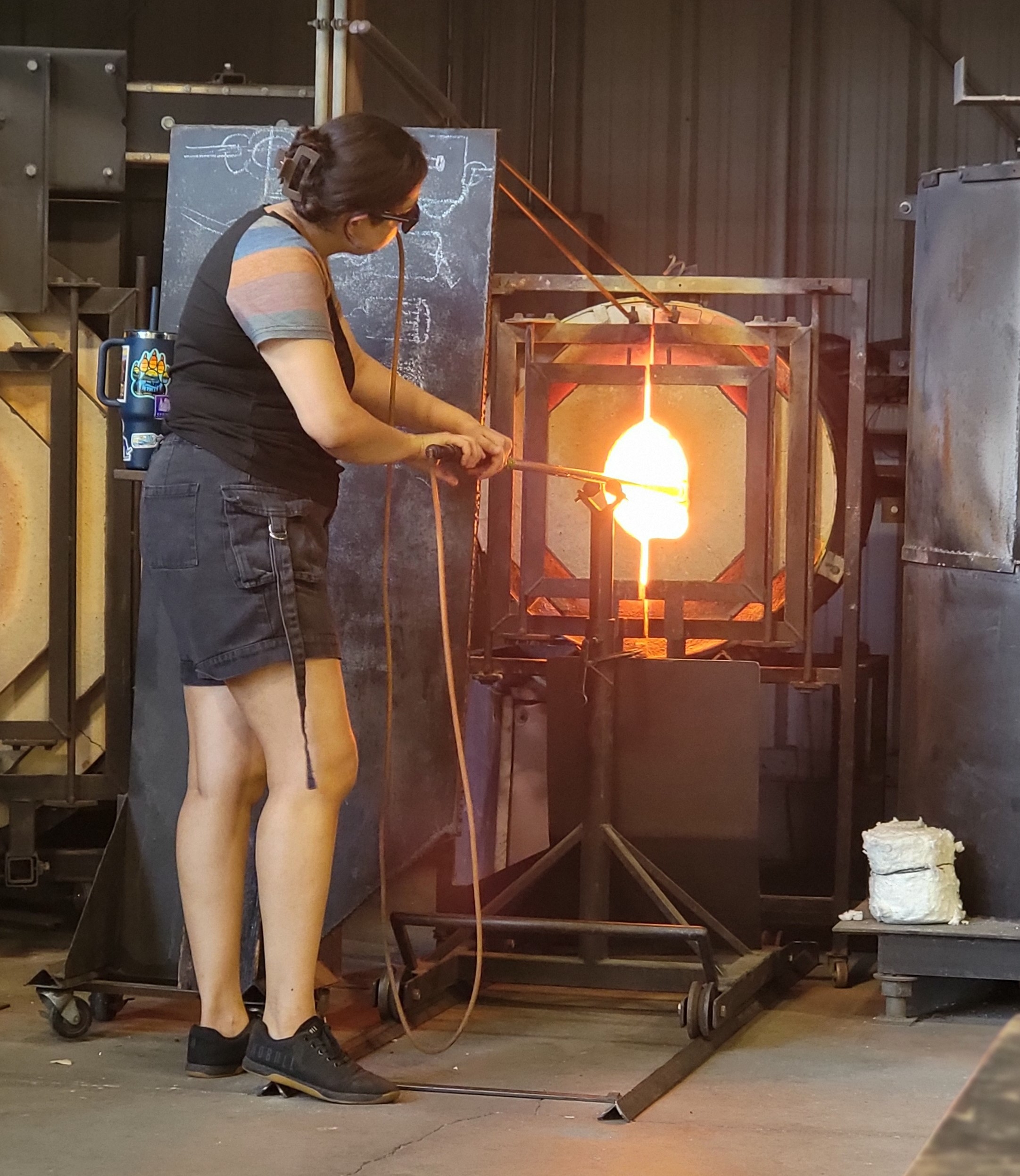 Artist Anjali Singh refines glass in a furnace of 2,000 degrees Fahrenheit.