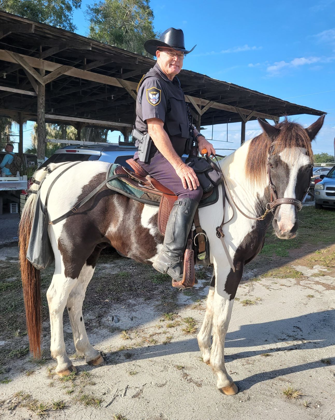 Darrell Herrick steadies Little Joe who loves carrots while on duty